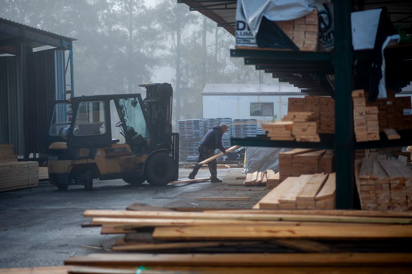 Man Working On Wood Warehouse — Mt. Olive, AL — Shaw Building Supply