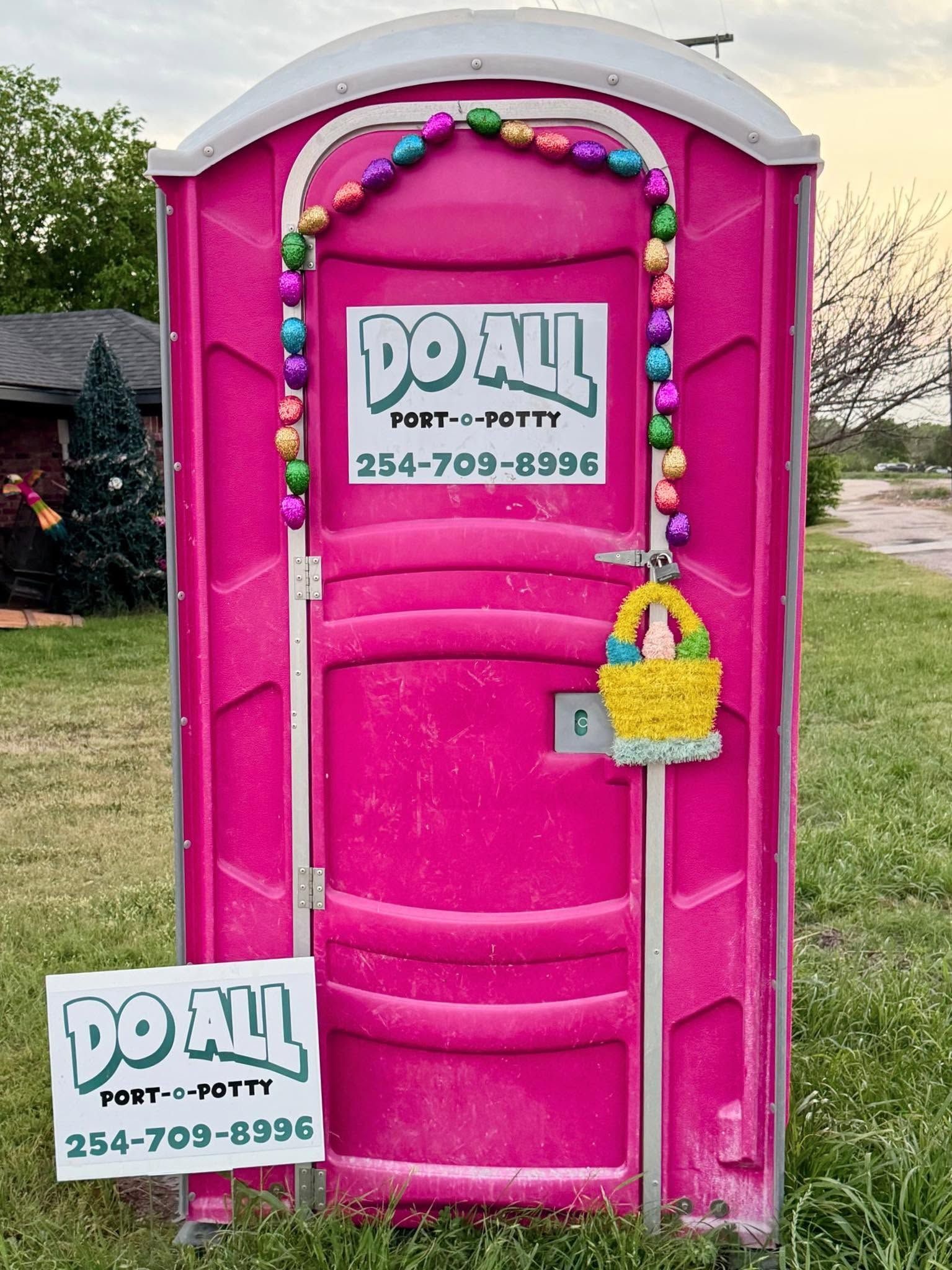 Bright pink portable toilet with a 
