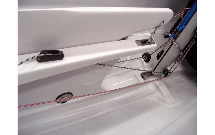 A close up of a white boat with a rope attached to it