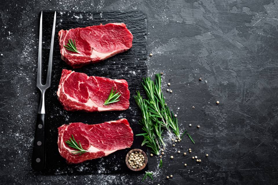 raw meat  on black plate