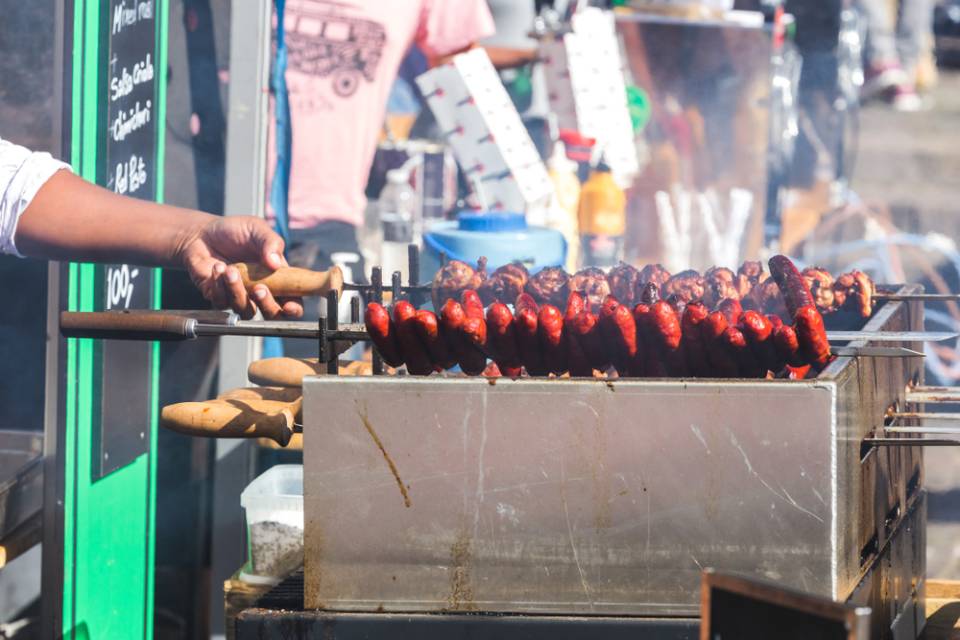 man grilling meat