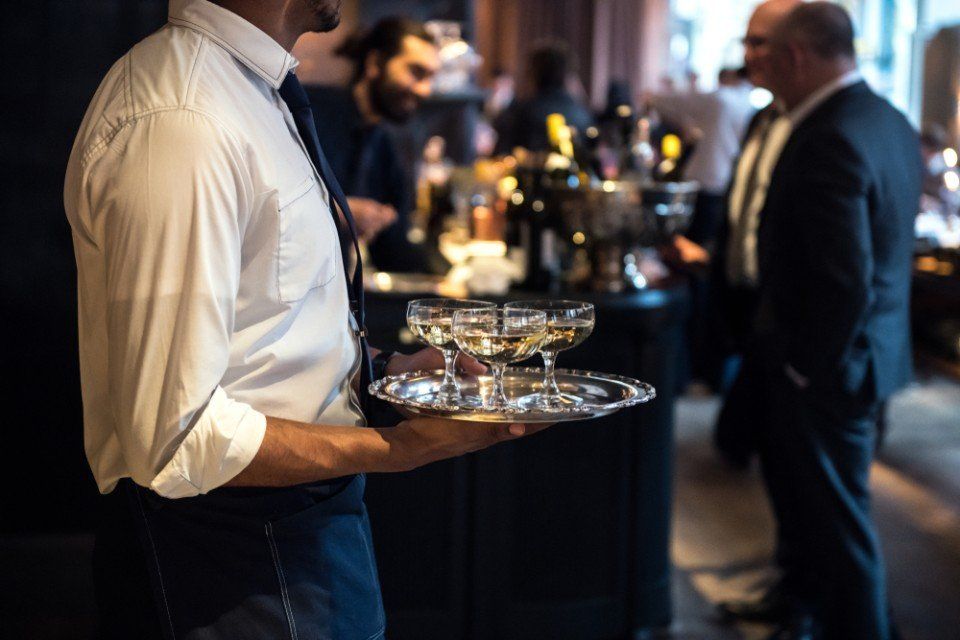 man serving drinks