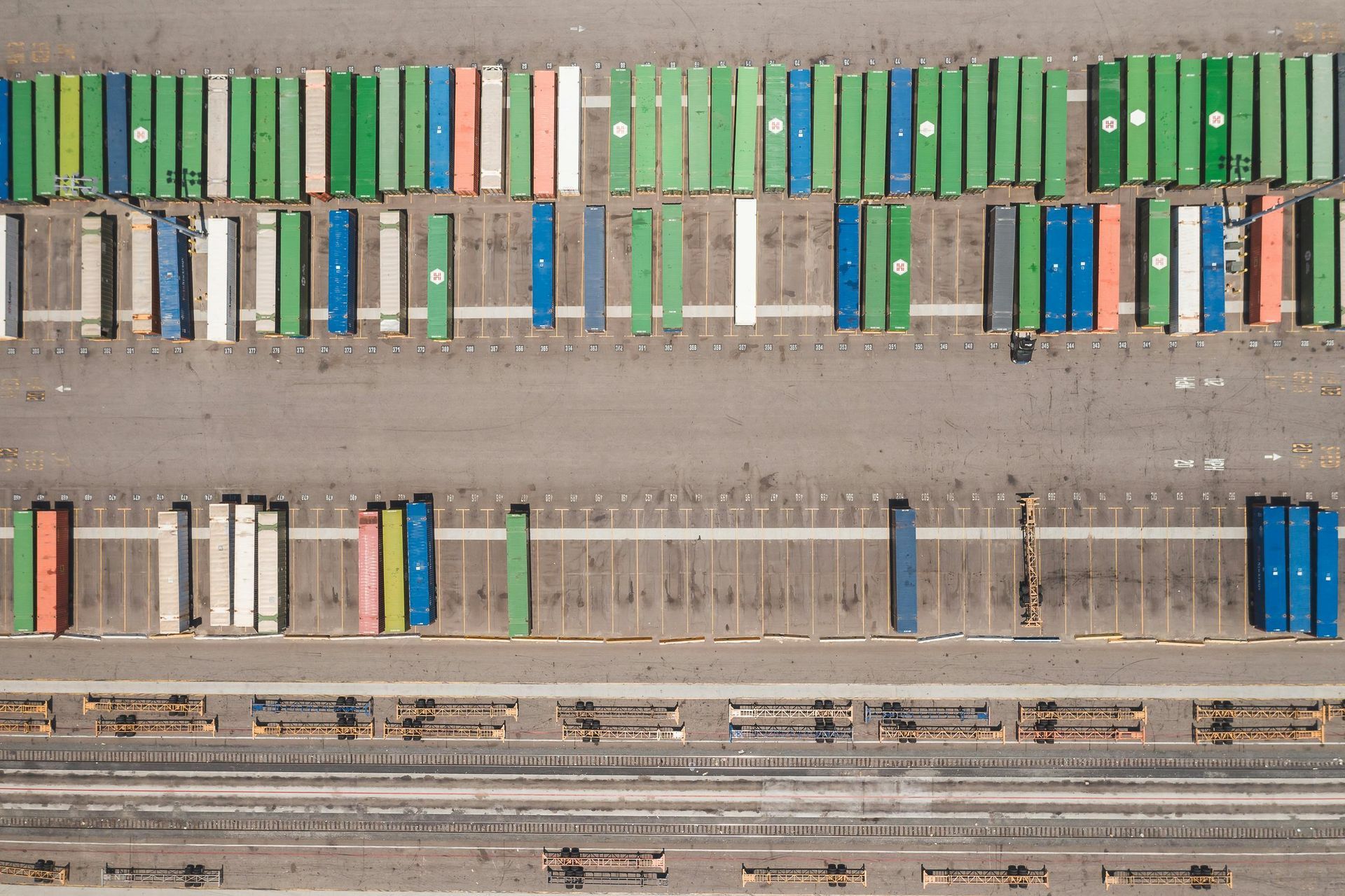 An aerial view of a row of colorful shipping containers.