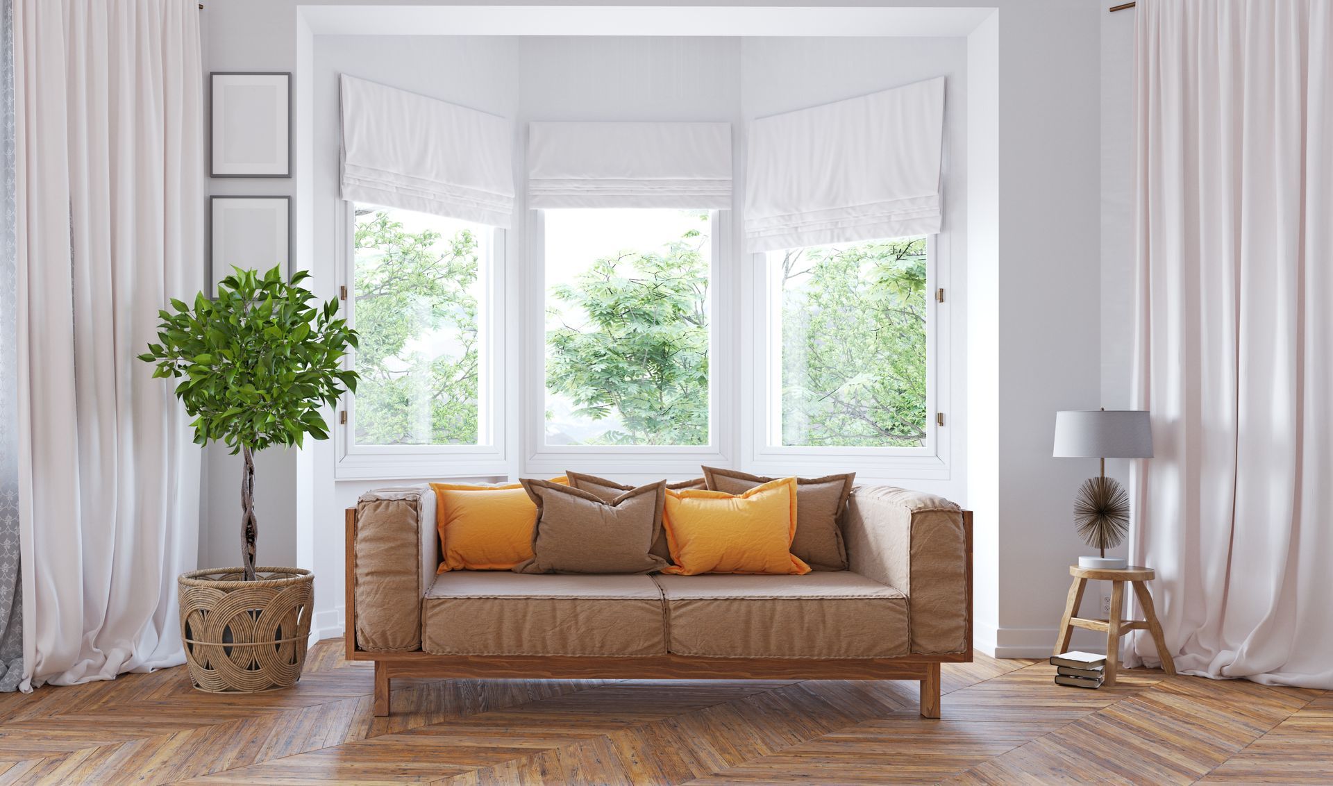 Bright living room with tan sofa, yellow pillows, bay windows, potted plant, and wooden stool lamp