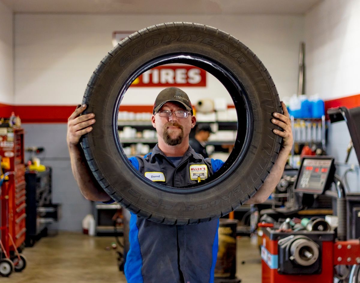 Team-with-tire | Levrett Automotive