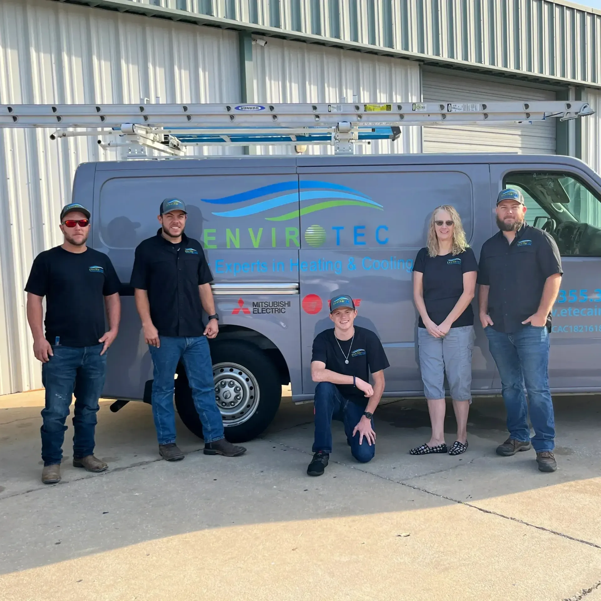 Hvac Contractor Bradenton - a group of people standing in front of a van that says envirotec