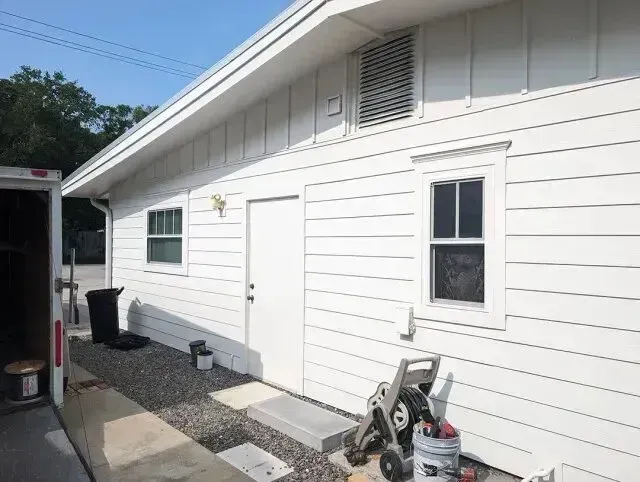 Hvac Contractor Bradenton - A white house with a trailer parked in front of it