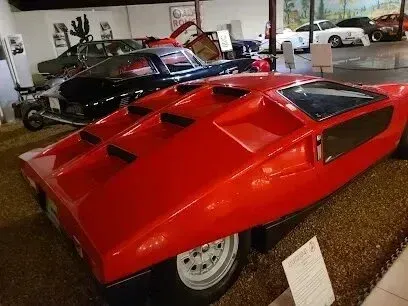 Hvac-Contractor-Bradenton-A red sports car is on display in a museum.