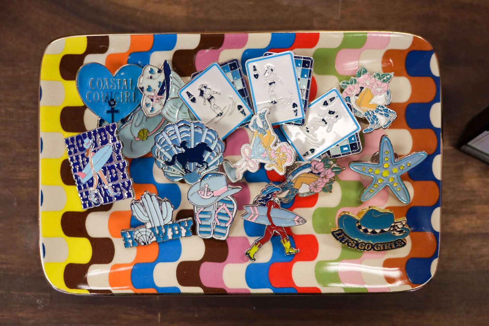 Colorful tray filled with blue and silver butterfly and star-shaped craft pieces