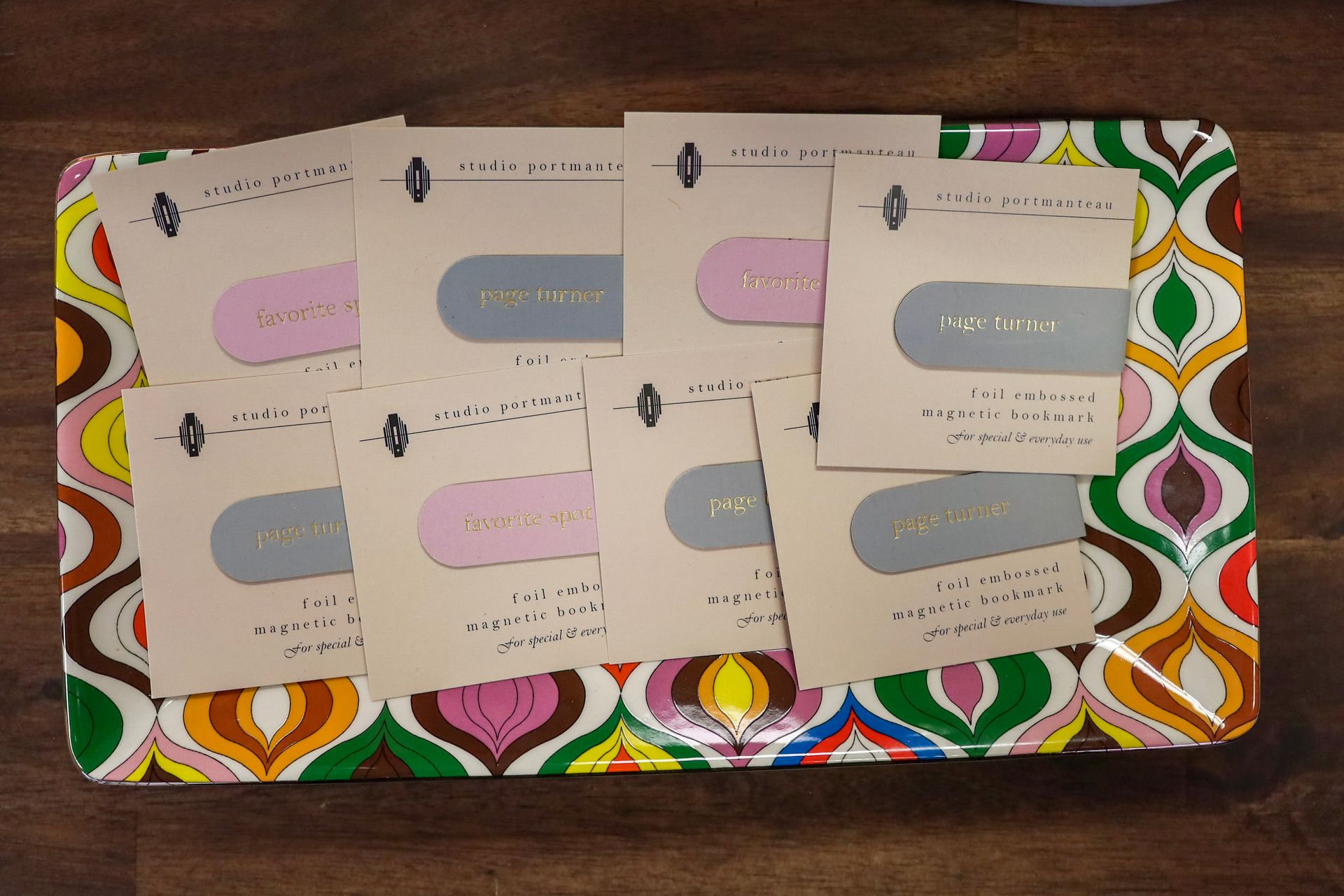 Assorted pastel thank-you cards spread on a colorful patterned mat