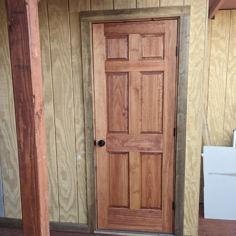A wooden door with a knob on it