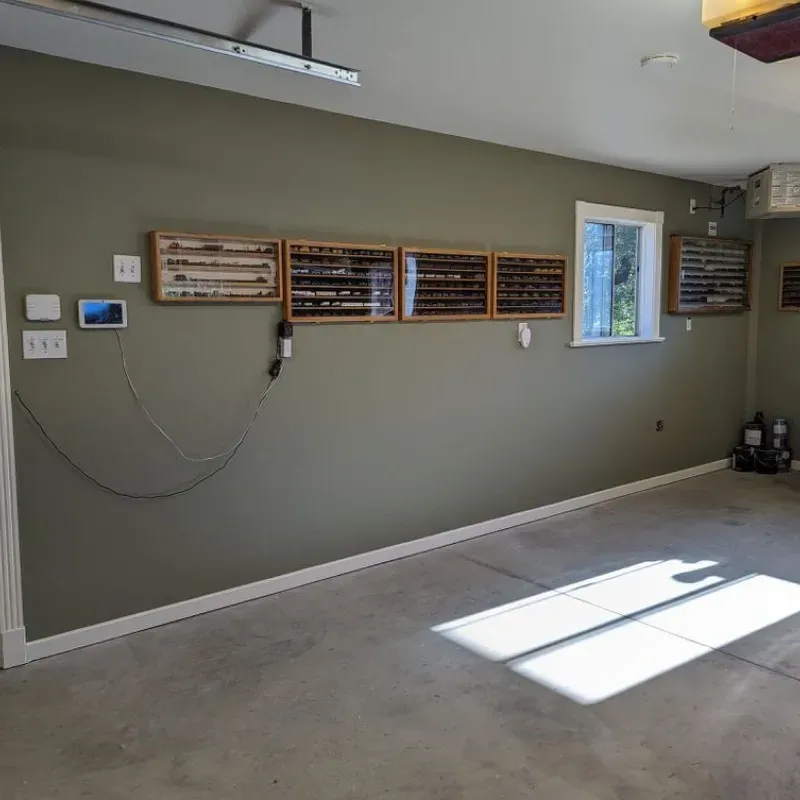 An empty garage with a lot of plaques on the wall.