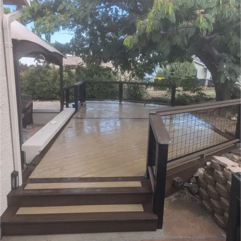 A wooden deck with stairs leading up to it