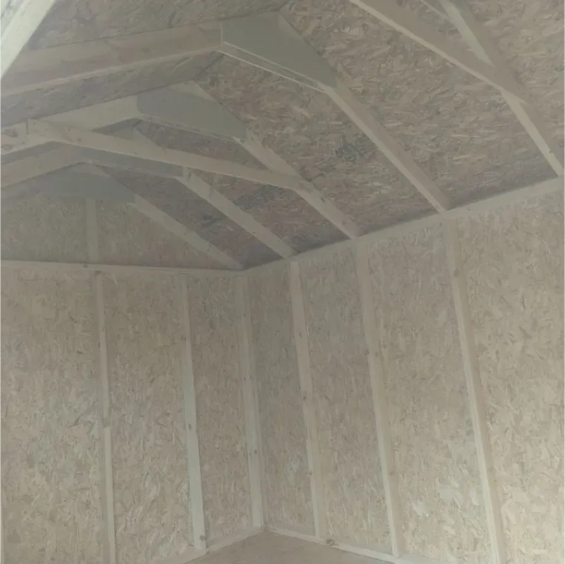 The inside of a shed with a wooden roof and walls.