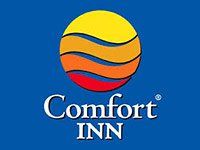 Comfort Inn logo: yellow, orange, and red layers in a circle over blue background; 