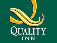 Quality Inn logo: Gold stylized ribbon over 