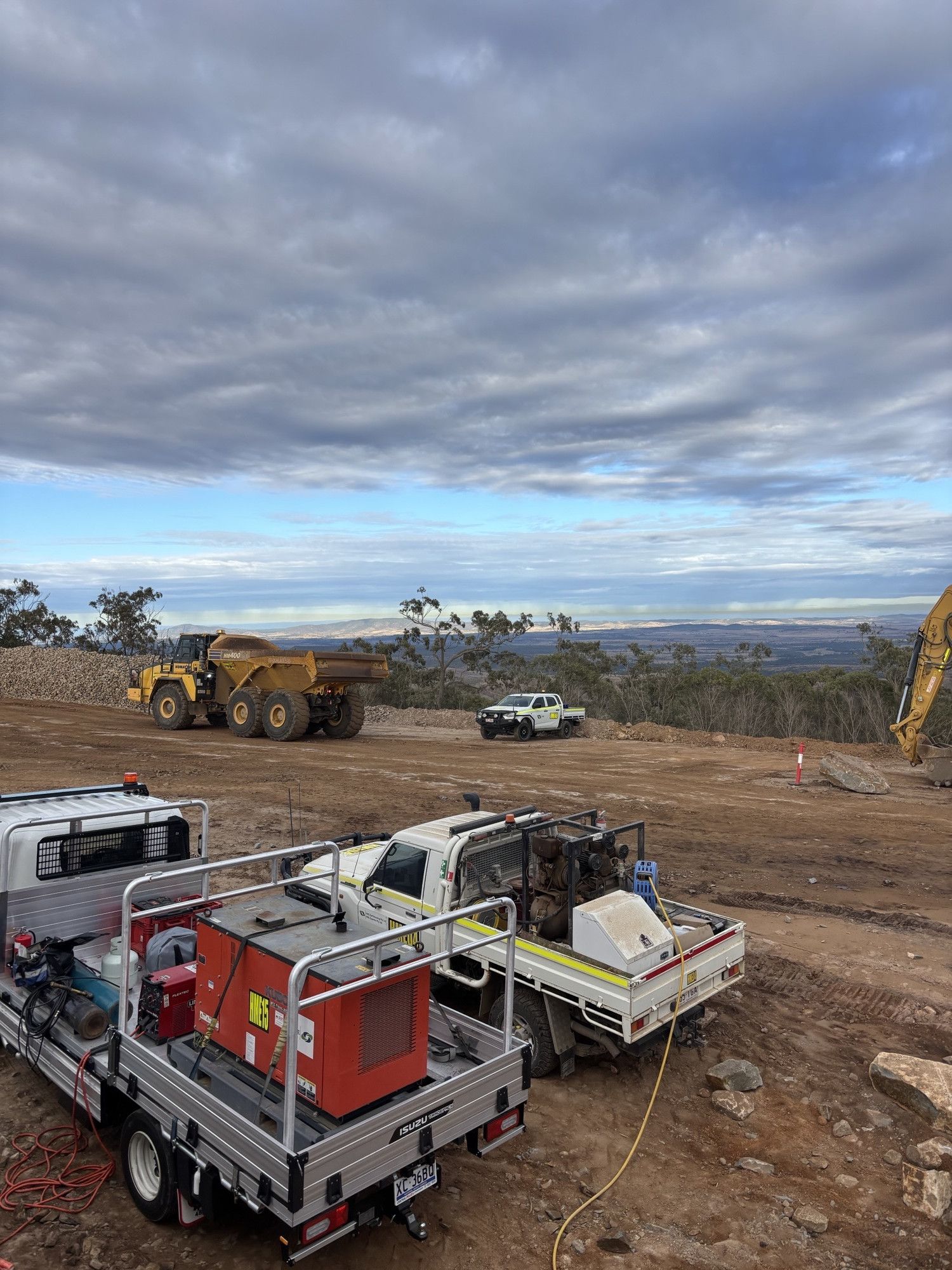 Work  Vehicles at a Worksite — Harris Engineering Services CQ In Gracemere, QLD