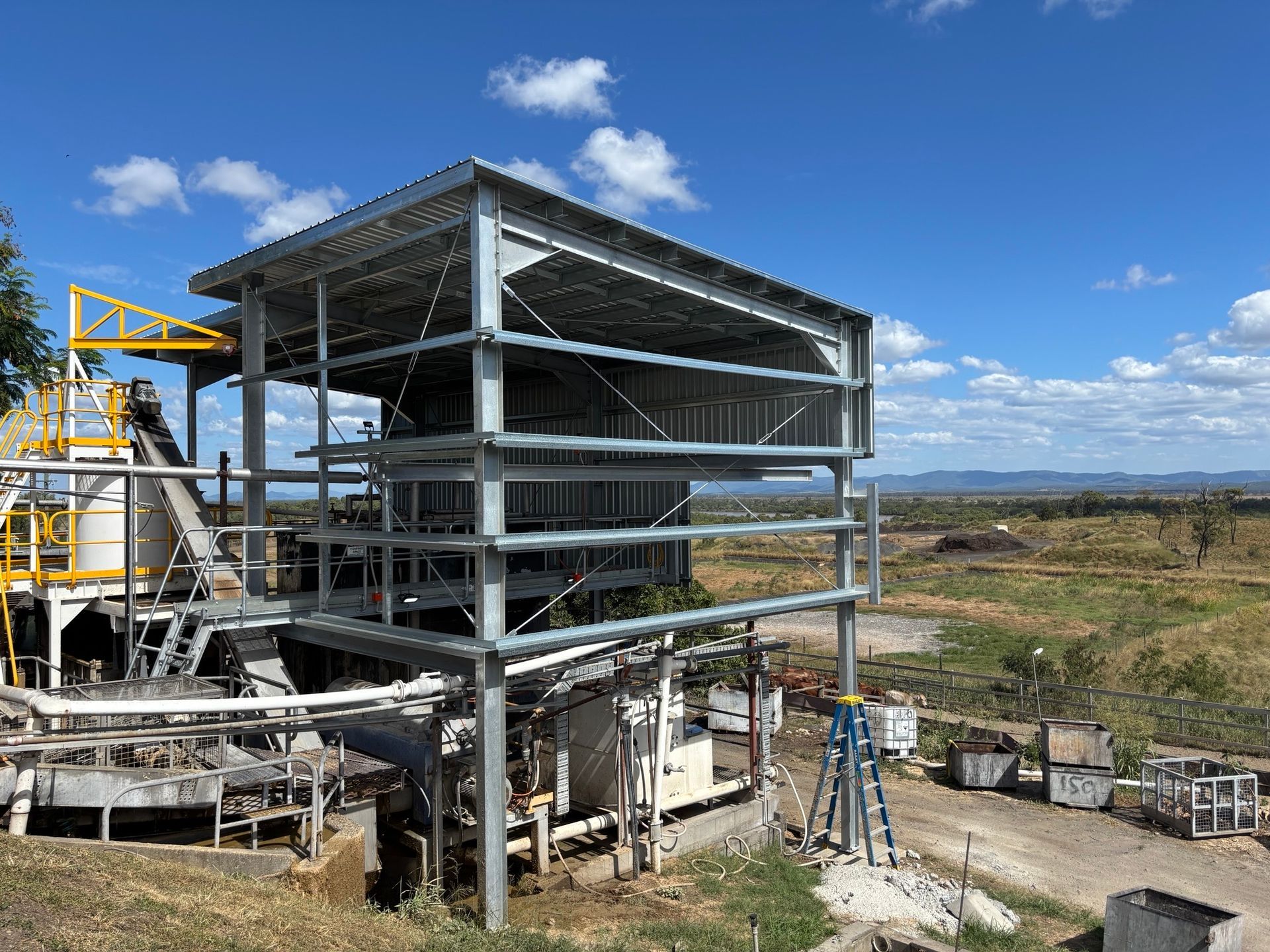 Worker in Orange Safety Gear and Yellow Hard Hat — Harris Engineering Services CQ In Gracemere, QLD