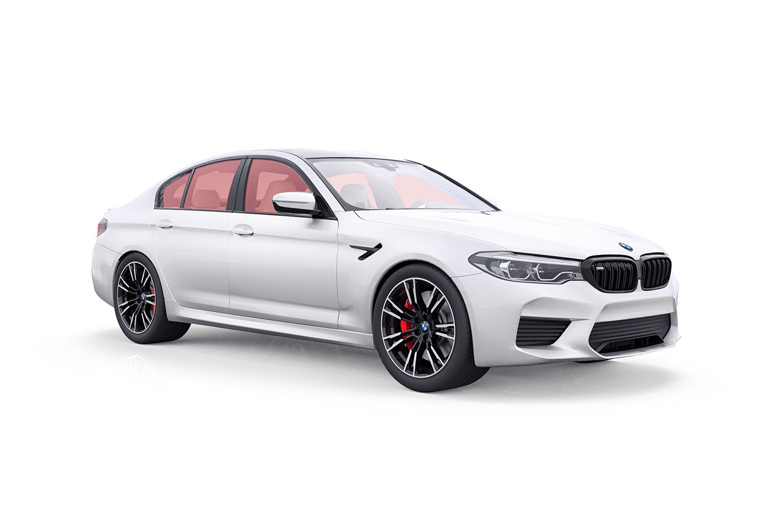 White BMW M5 sedan with black wheels, red brake calipers, and tinted windows.