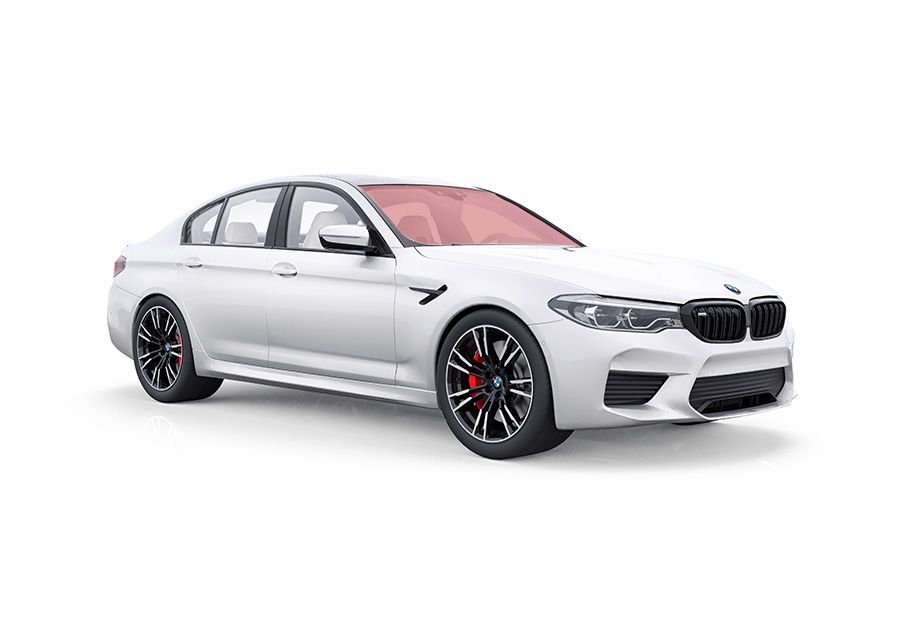 White BMW M5 sedan with black wheels and red brake calipers.