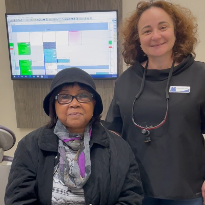 Dr. Lyuba Taft and her patients smiling
