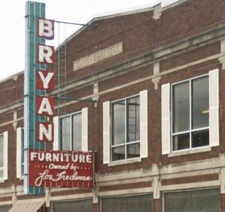 A building with a sign that says bryan furniture