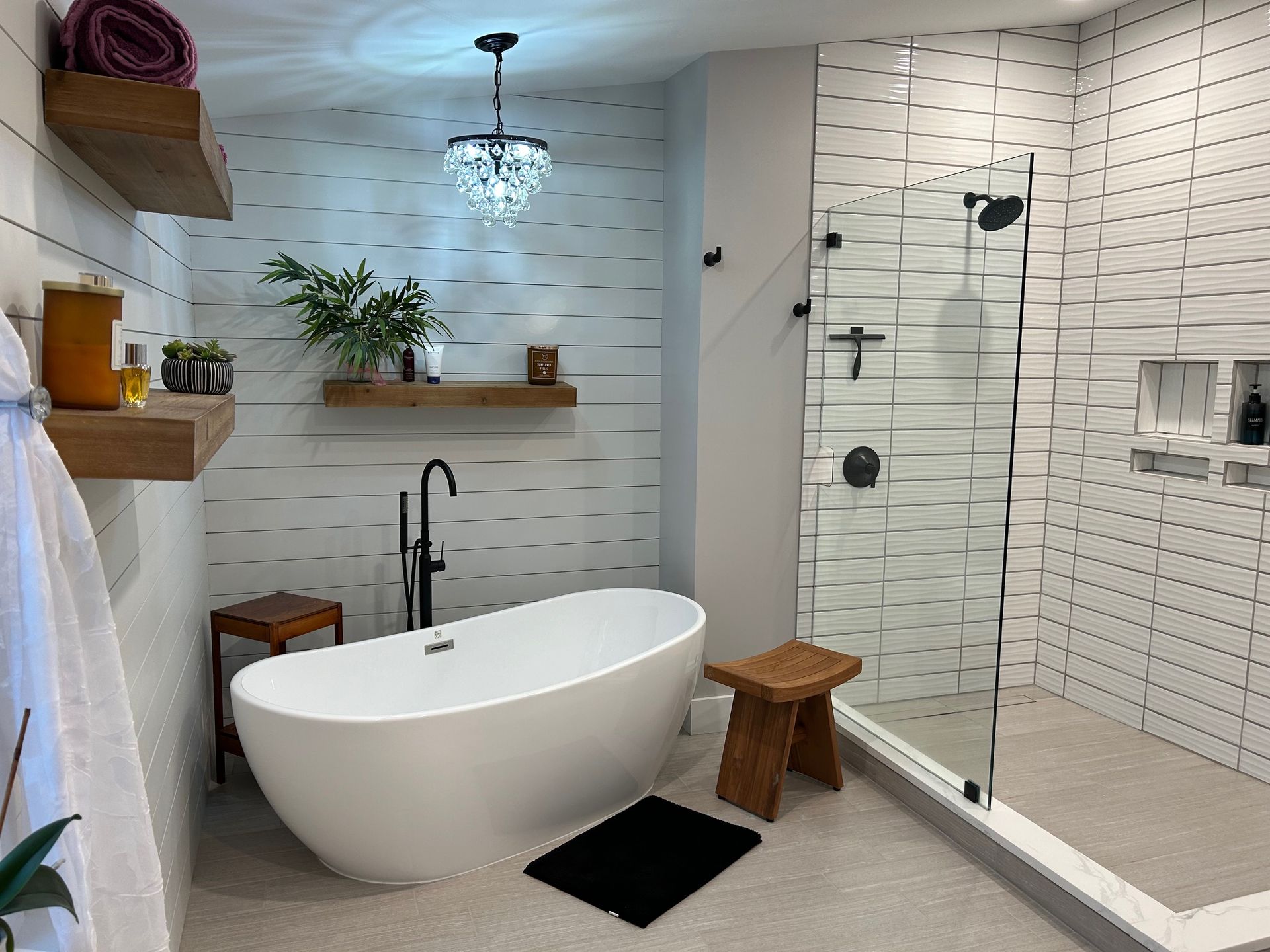 A bathroom with a bathtub and a walk in shower.