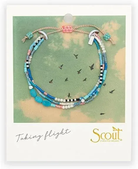 Blue beaded bracelet on a card with “Taking flight” text and Scout logo