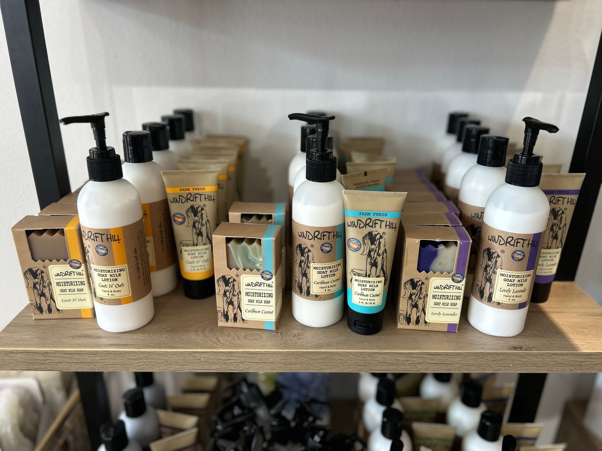 Shelves of assorted hair and body care products, including lotions and soaps, in a store display