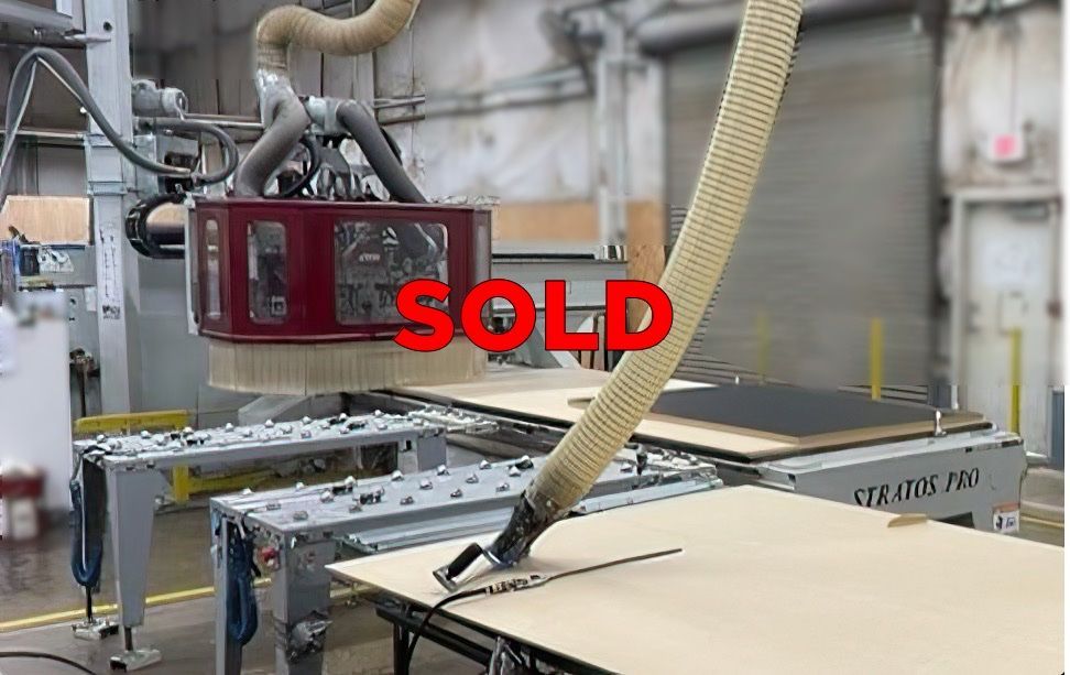 Close-up of a pre-owned CNC router table marked 