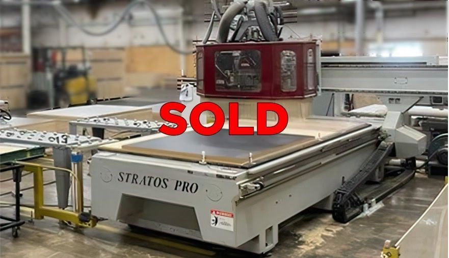 Close-up of a pre-owned CNC router table marked 