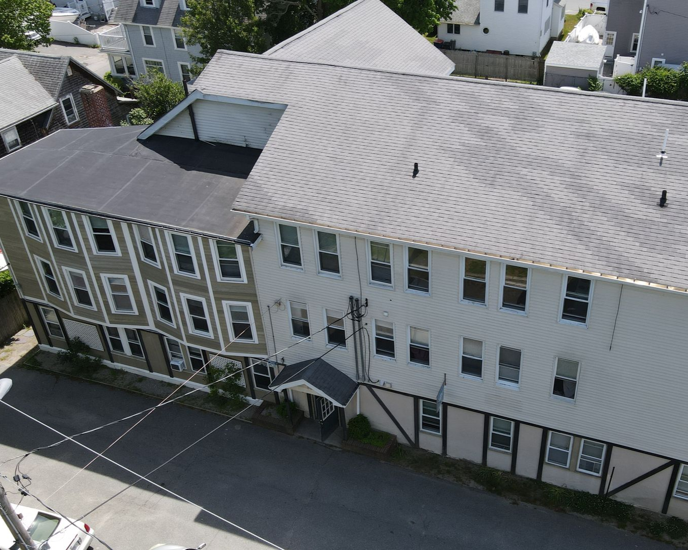 A large building with a chimney on the side of it