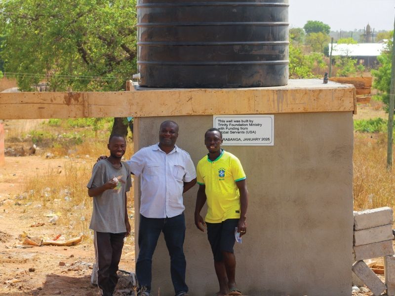 Dr. Dan Odarno with at the well in Larabanga, Ghana