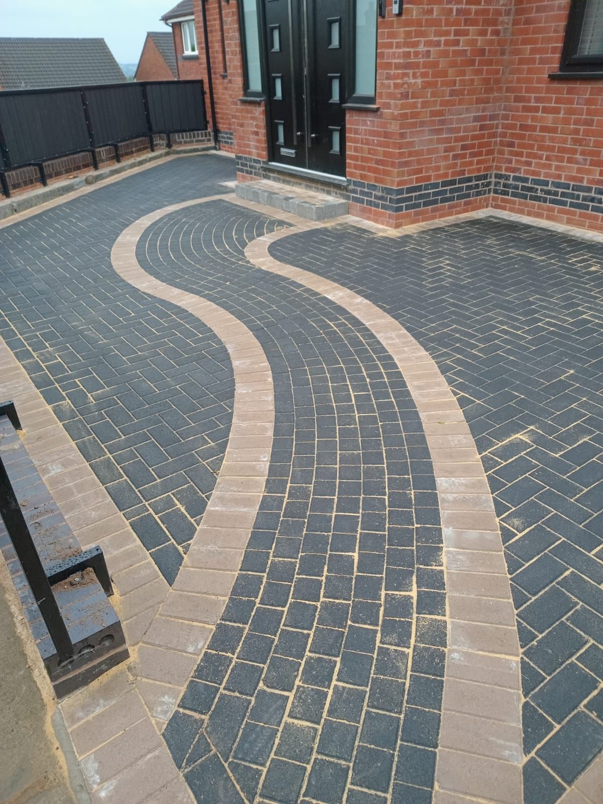 A picture of a block paved driveway installed by Cambridge Driveways