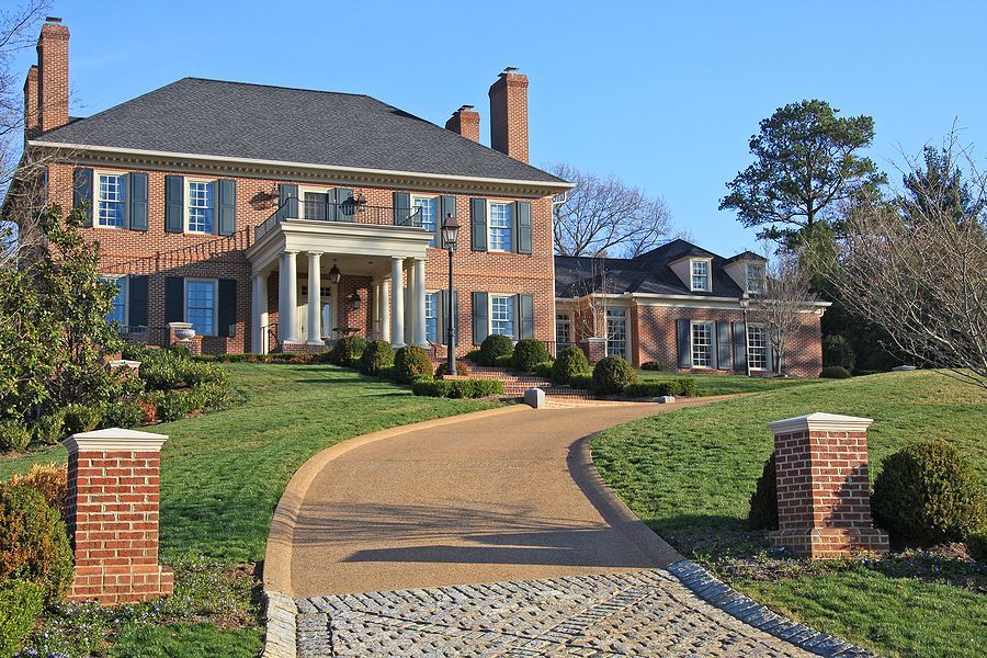 A large house with a resin driveway. Installed by Cambridge Resin Driveways