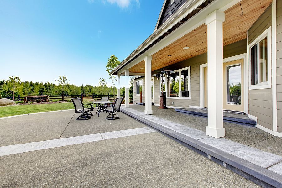 A large resin patio area with table and chairs in Cambridge