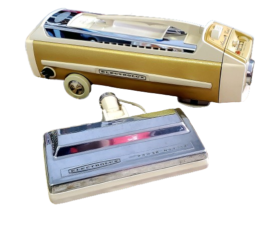 Two vintage gold-and-silver toy cars with clear tops, one stacked above the other