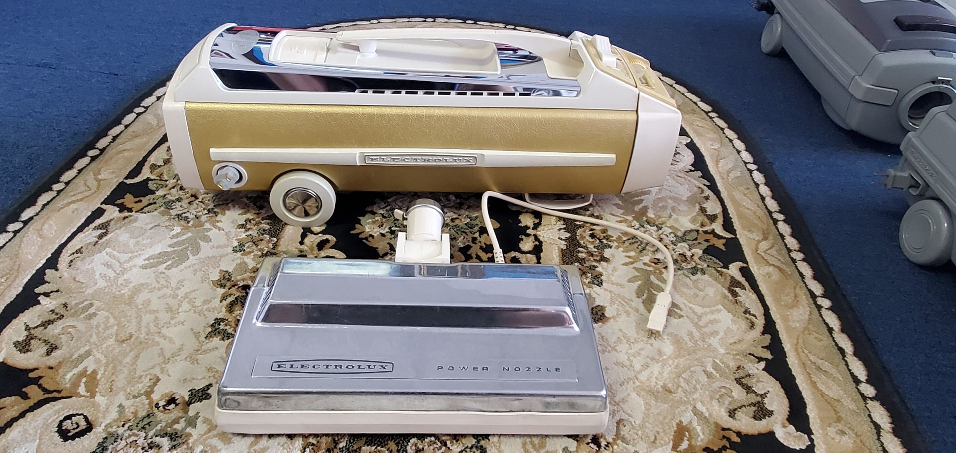 Three vintage cassette players and a white boombox on a patterned rug