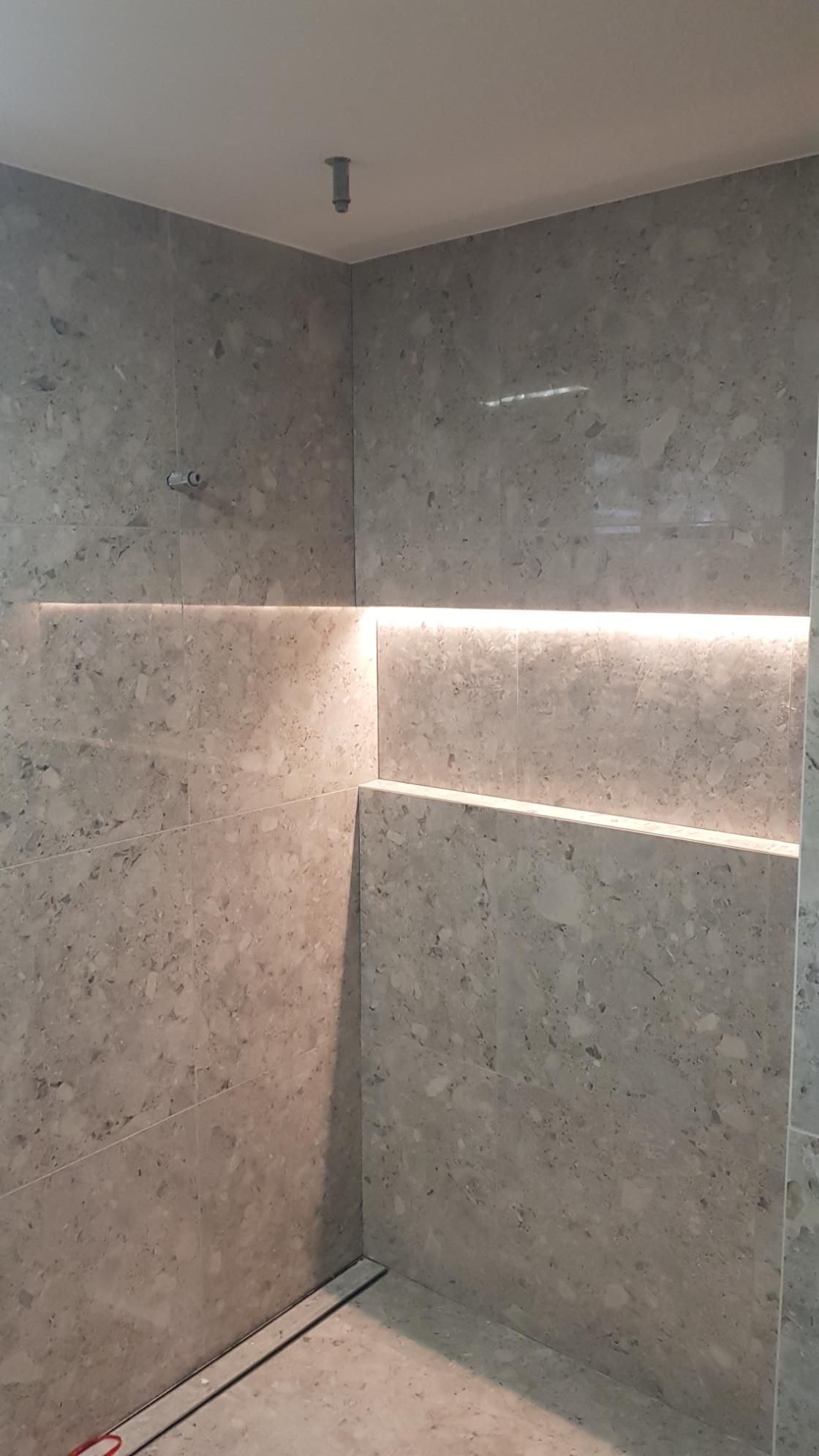 A Bathroom With A Shower And A Shelf In The Wall — AH Electrical in Alstonville, NSW