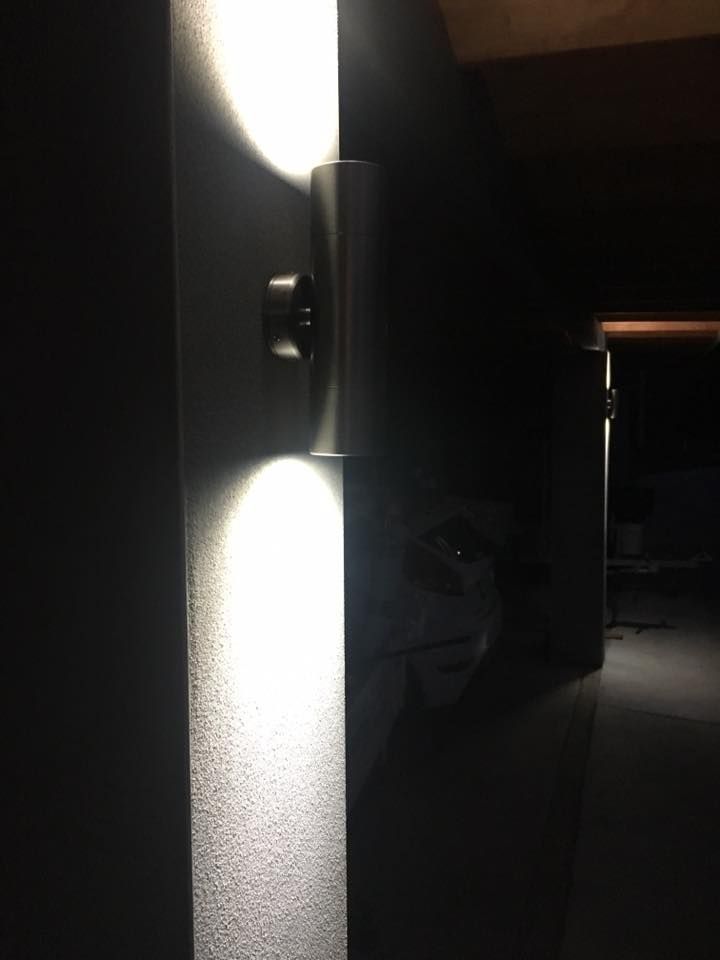 A Light is Shining on a Wall in a Dark Room — AH Electrical in West Ballina, NSW