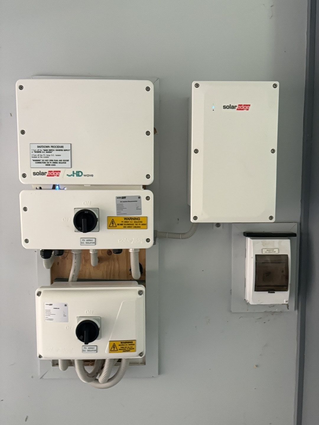 A Wall With A Bunch Of Electrical Boxes On It — AH Electrical in Ballina, NSW