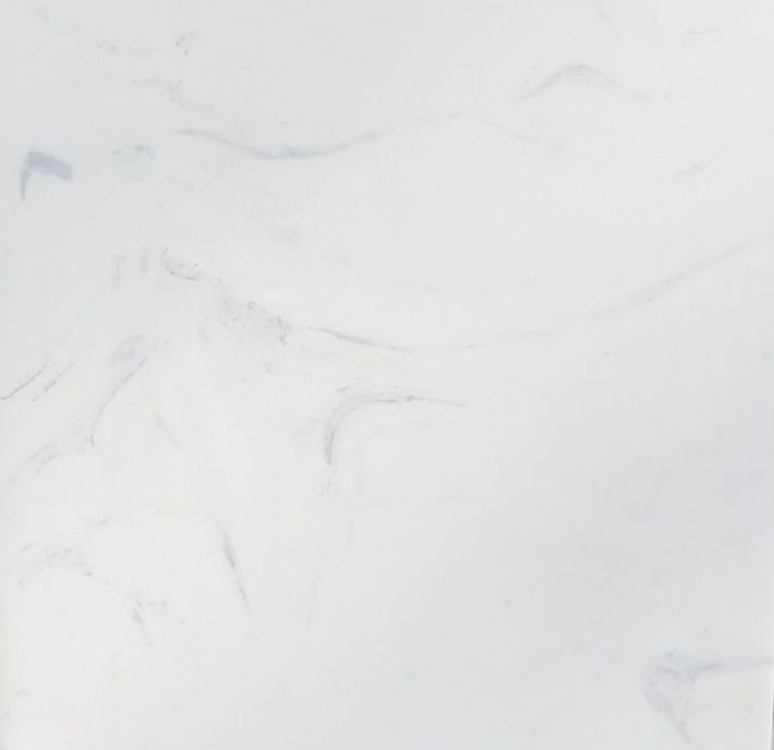 A texture of white marble stone with subtle grey veining running diagonally across the surface. A texture of white marble stone with subtle grey veining running diagonally across the surface.