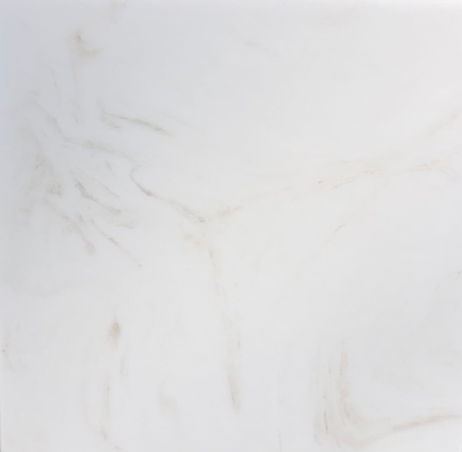 A texture of white marble stone with subtle grey veining running diagonally across the surface. A texture of white marble stone with subtle grey veining running diagonally across the surface.