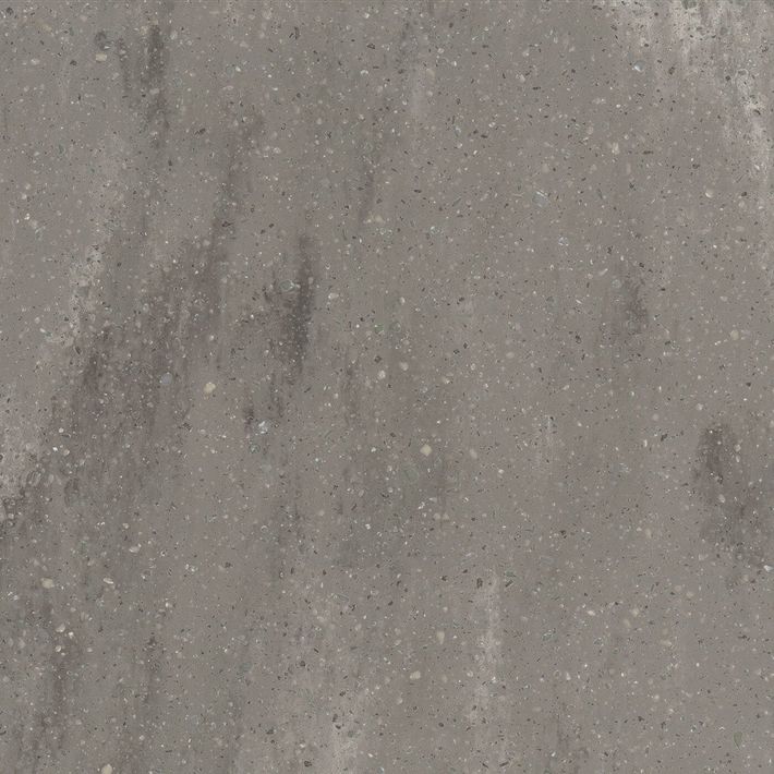 A close-up, top-down view of a textured dark gray stone surface with subtle white and green mineral veining throughout. A close-up, top-down view of a textured dark gray stone surface with subtle white and green mineral veining throughout.