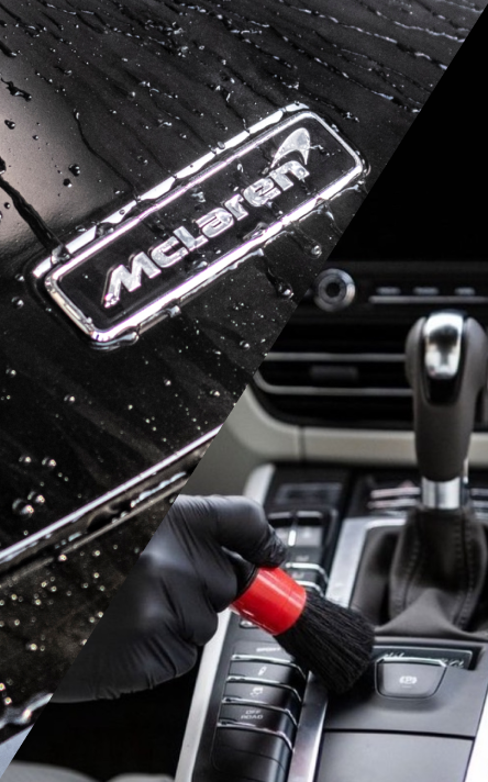 A wet car logo on a black car and the gear shift inside the vehicle. 