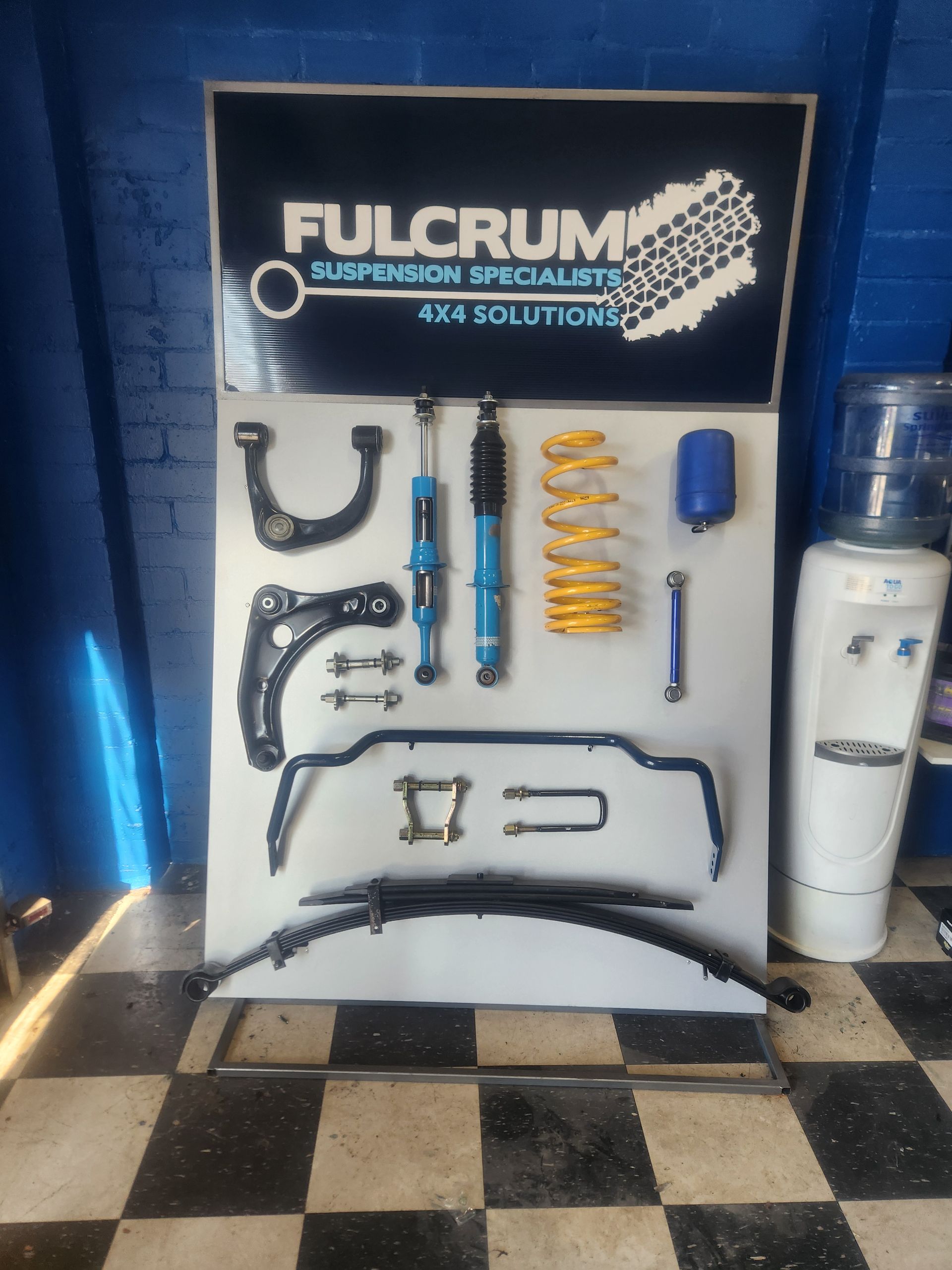 Fulcrum Suspension Parts Display: Blue and Yellow Shocks, Springs — Autoplus Professionals Picton in Picton, NSW