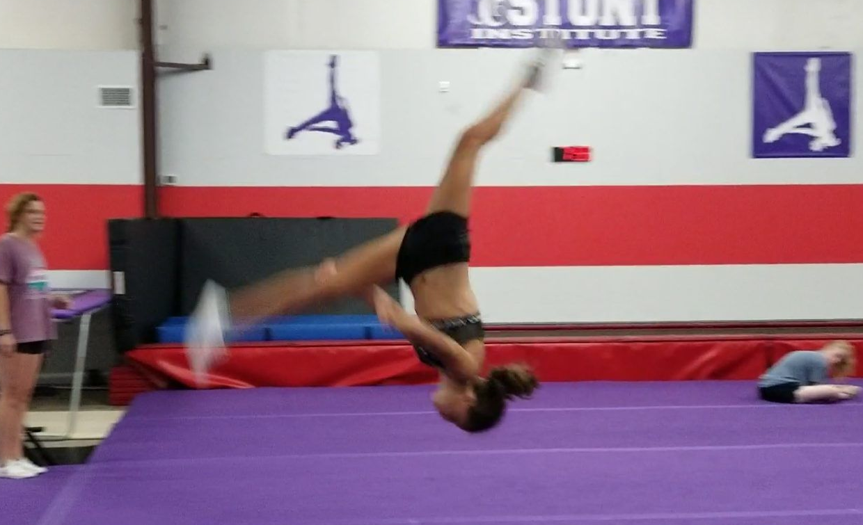 Tumble and Stunt Student demonstrating a Layout Stepout