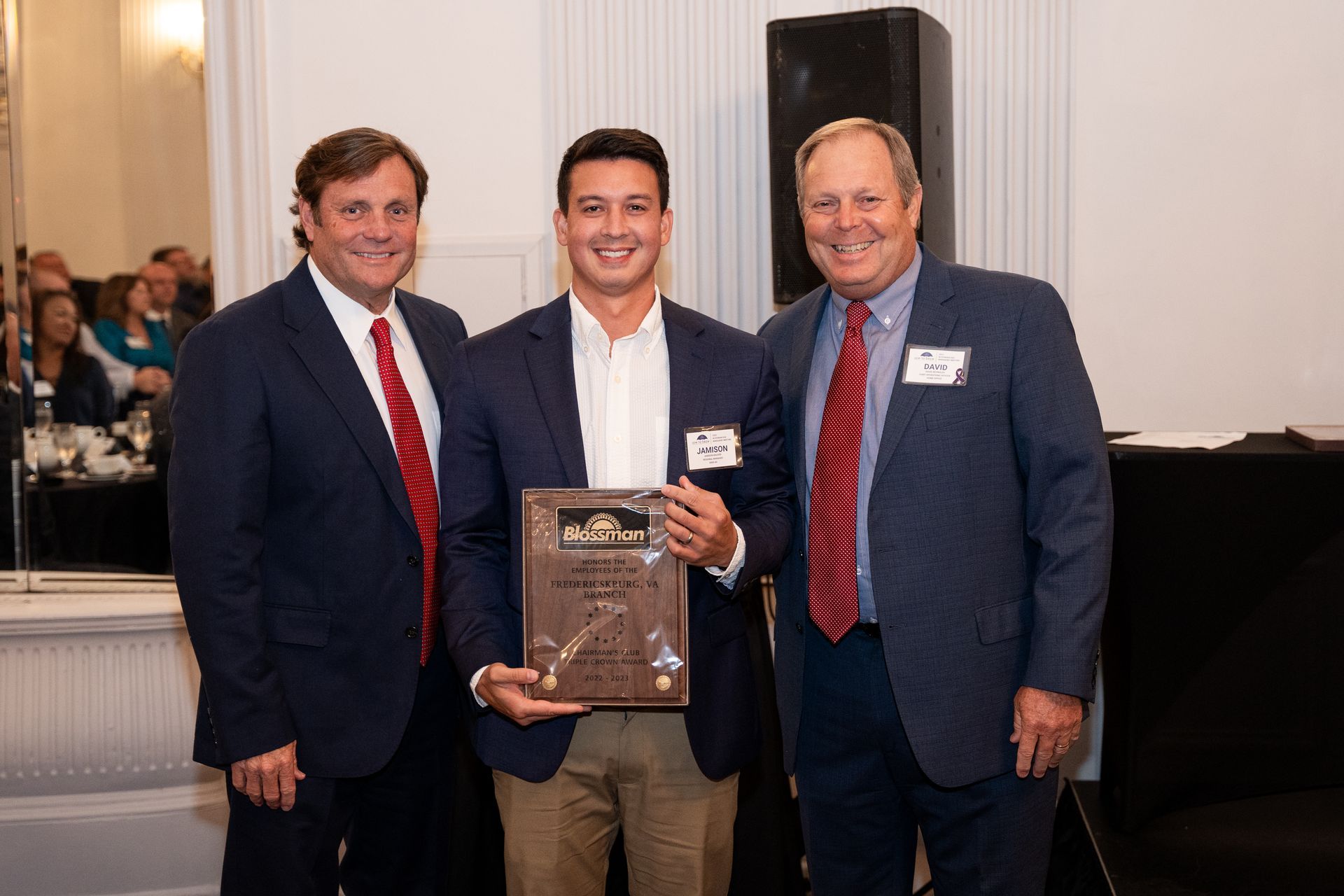 Gentlemen receiving an award at an event