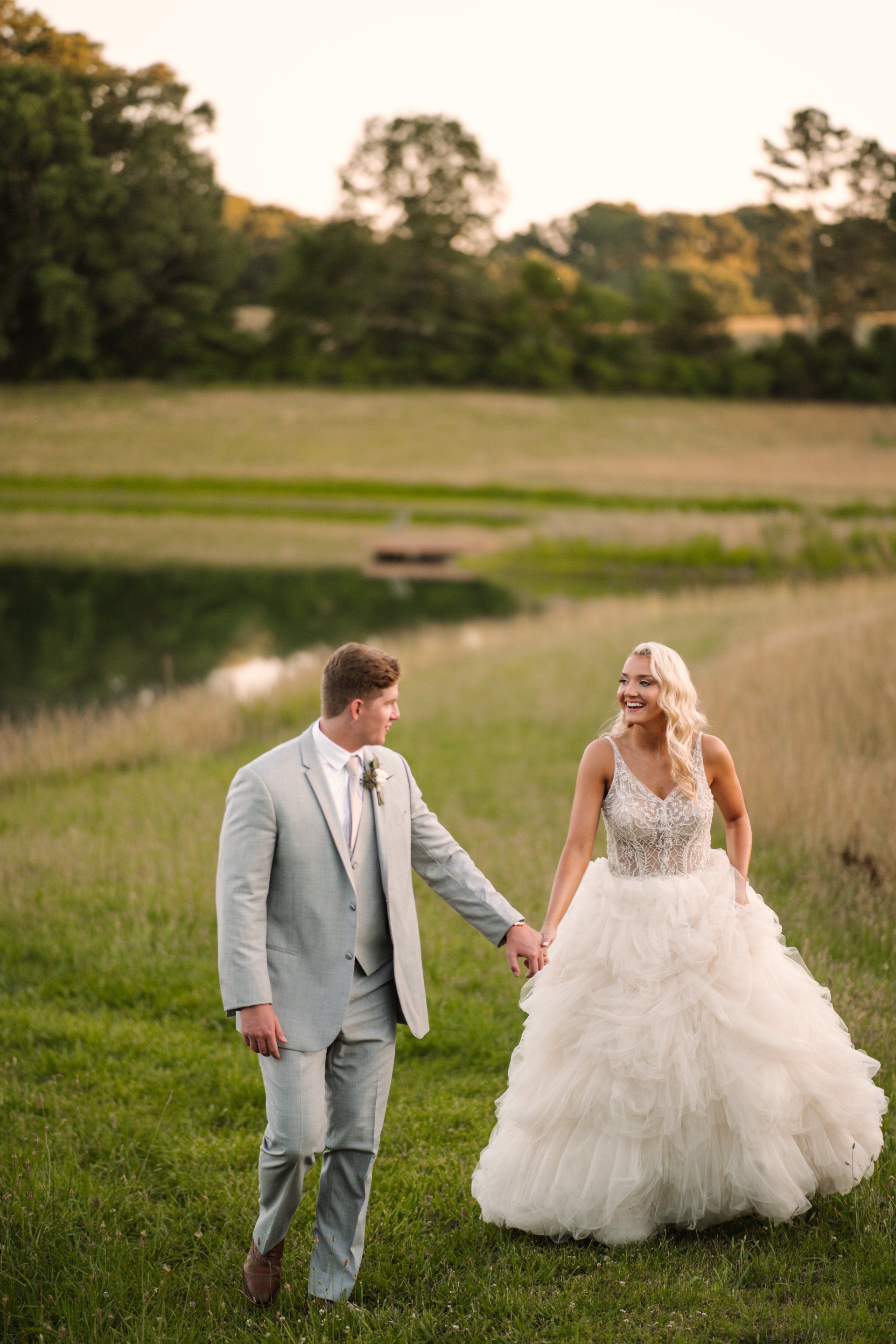 Bride and groom walking together at Howe Farms photographed by
a Chattanooga Wedding Photographer