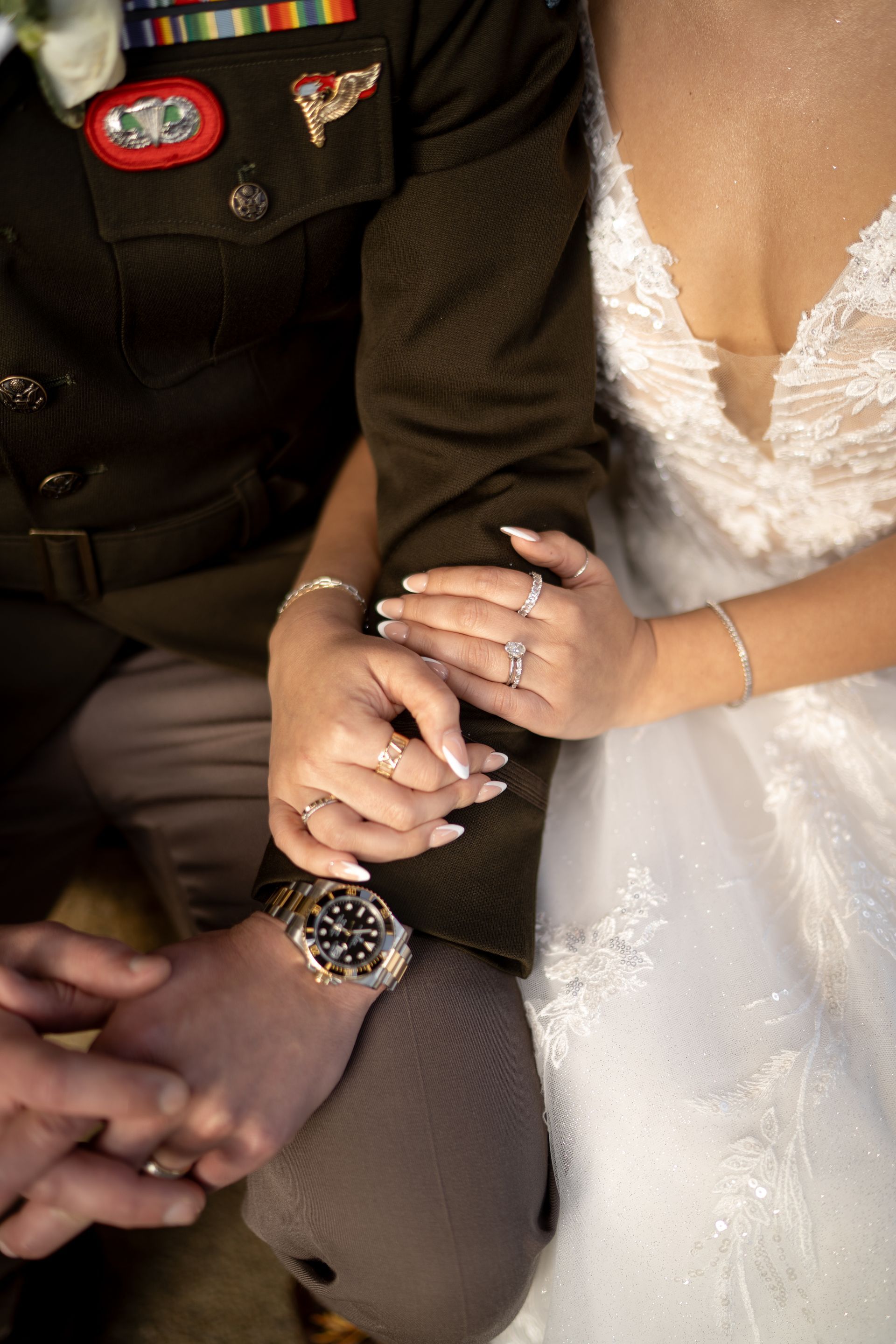 Bride and military groom holding hands at the Parthenon in Nashville after their wedding